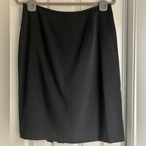 Woman’s black pin stripe straight skirt stylish chic minimalist travel work 10
